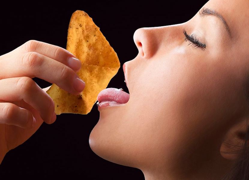 Woman eating Doritos