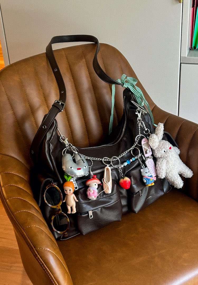 Sonny Angels, lace bows and flip phones: How five Australian creatives are wearing bag charms