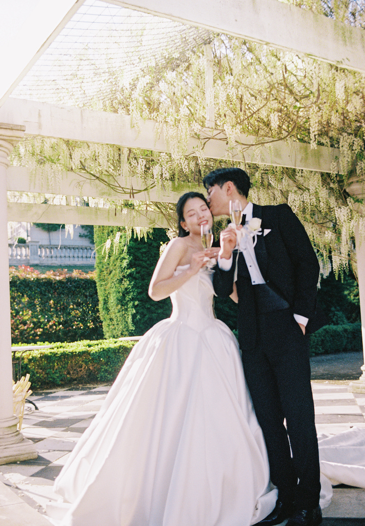 Five dresses, white wisteria and a string quartet: Inside Jenn and Eric’s fairytale wedding